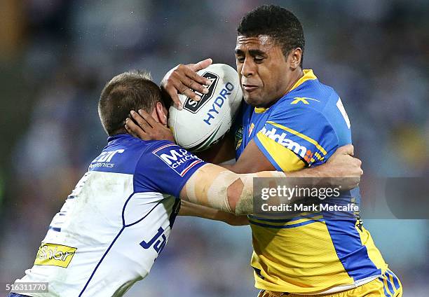 Michael Jennings of the Eels is tackled during the round three NRL match between the Canterbury Bulldogs and the Parramatta Eels at ANZ Stadium on...