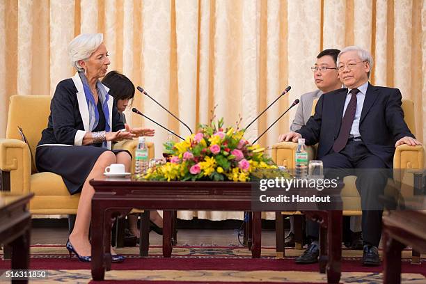 In this handout photo provided by the International Monetary Fund , International Monetary Fund Managing Director Christine Lagarde meets with...