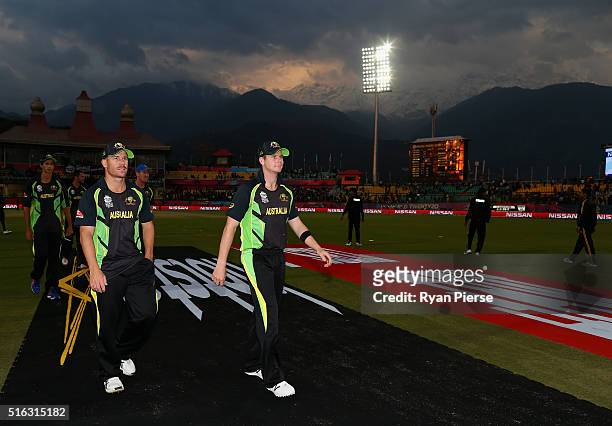 David Warner and Steve Smith of Australia lead their team from the ground after the ICC World Twenty20 India 2016 Super 10s Group 2 match between...