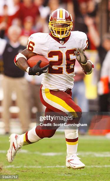 Clinton Portis of the Washington Redskins runs against the Green Bay Packers at FedEx Field on October 31, 2004 in Landover, Maryland. The Packers...