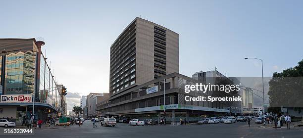 pano of modern office blocks in downtown harare, zimbabwe - harare stock pictures, royalty-free photos & images