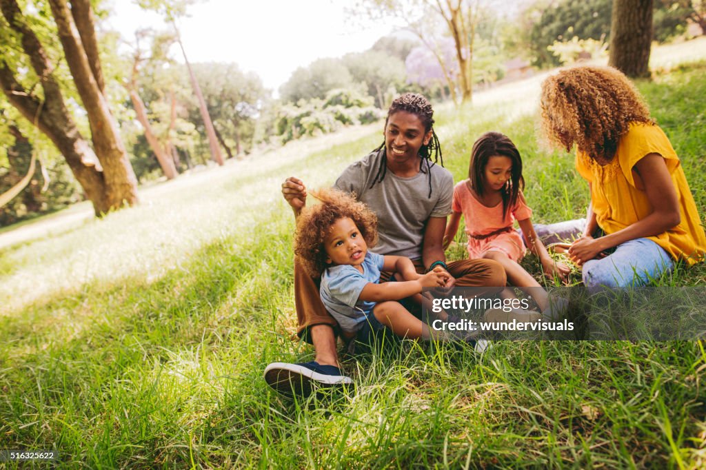 Cute brother and sister spends time with their parents.