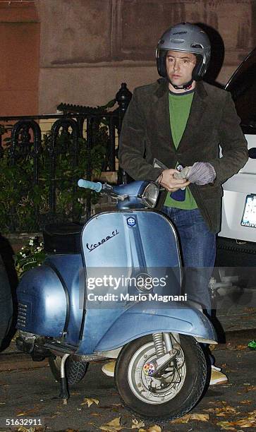 Actor Matthew Broderick sets off on his Vespa scooter October 31, 2004 in New York City.