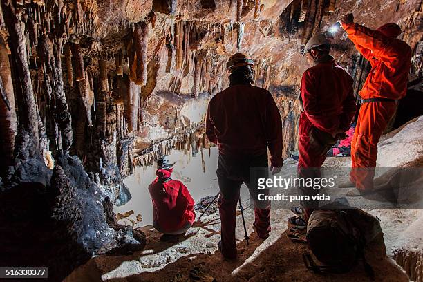 photographing caves - espeleología fotografías e imágenes de stock
