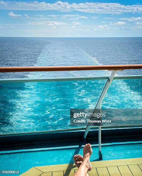 person relaxing on a deck of a cruise ship - cruise deck stock pictures, royalty-free photos & images