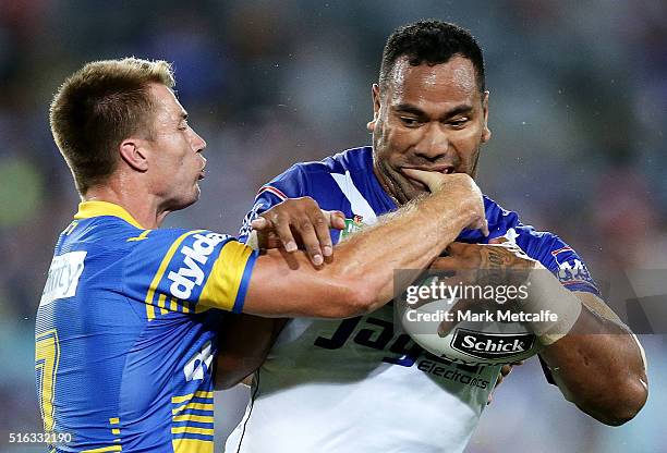 Tony Williams of the Bulldogs is tackled by Kieran Foran of the Eels during the round three NRL match between the Canterbury Bulldogs and the...