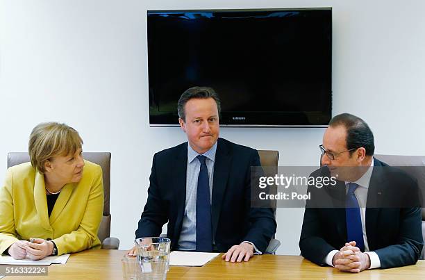 Germany's Chancellor Angela Merkel, Britain's Prime Minister David Cameron and France's President Francois Hollande attend a meeting during a...