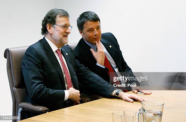 Spain's Prime Minister Mariano Rajoy talks with his Italian counterpart Matteo Renzi in a meeting during a European Union leaders summit on...