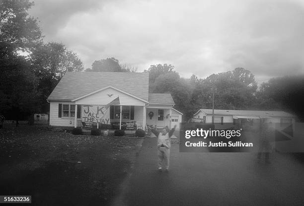 Supporters of Democratic presidential candidate U.S. Senator John Kerry wave at his motorcade October 16, 2004 near Chillicothe, Ohio.