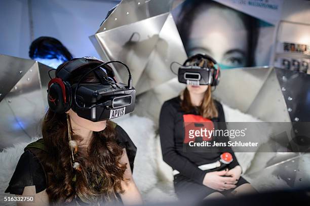 Two visitors sit with data eyeglasses during the Leipzig Book Fair 2016 on March 18, 2016 in Leipzig, Germany. From March 17 to March 20 more than...