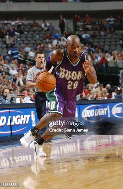 Erick Strickland of the Milwaukee Bucks drives to the basket during the preseason game against the Dallas Mavericks at American Airlines Arena on...