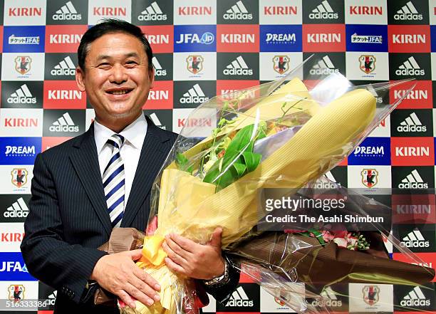 Outgoing Japan women's football national team head coach Norio Sasaki poses for photographs during a press conference announcing to step down at the...
