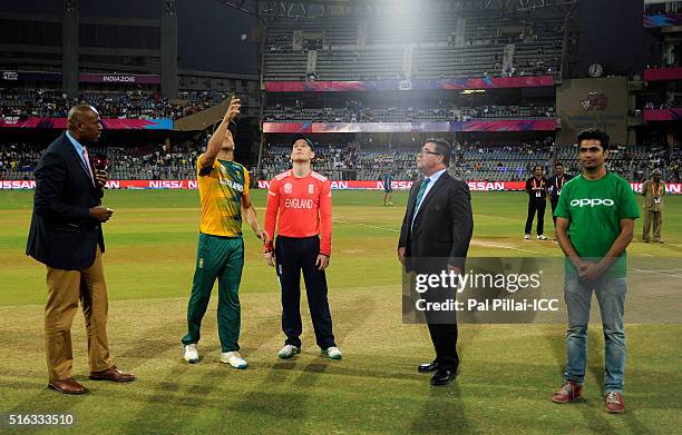 Mumbai, INDIA Faf du Plessis, Captain of South Africa Eoin Morgan Captain of England and Match referee David Boon during the toss before the start of...