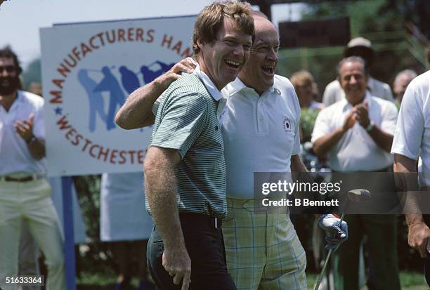 American golfer Tom Watson laughs with British-born American comedian and entertainer Bob Hope at the Manufacturers Hanover Westchester Classic golf...