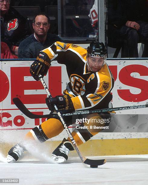 Ray Bourque of the Boston Bruins stops behind the net during a game against the New Jersey Devils at the Continental Airlines Arena circa 1990's in...