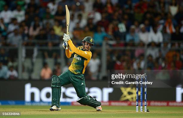 Quinton de Kock of South Africa hits out for six runs during the ICC World Twenty20 India 2016 Super 10s Group 1 match between South Africa and...