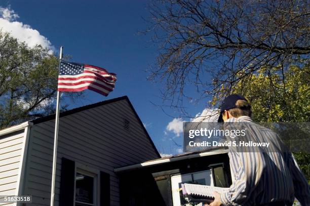 Tom Lindgren, assistant attorney general of the state of Ohio, goes door to door as part of Republican "Get Out The Vote Sidewalk Scramble" campaign,...