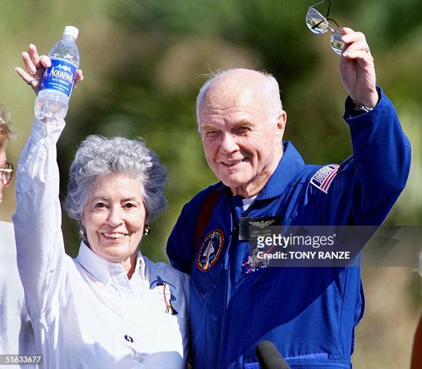 Astronaut John Glenn and his wife Annie wave to friends at the Kennedy Space Center, FL 08 November as the crew of the Shuttle Discovery prepared to...