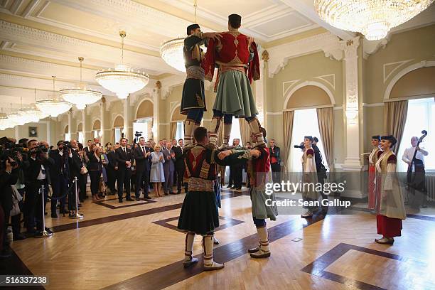 Prince Charles, Prince of Wales, and Camilla, Duchess of Cornwall, watch a Montenegran folk dance ensemble perform at a cultural heritage event on...