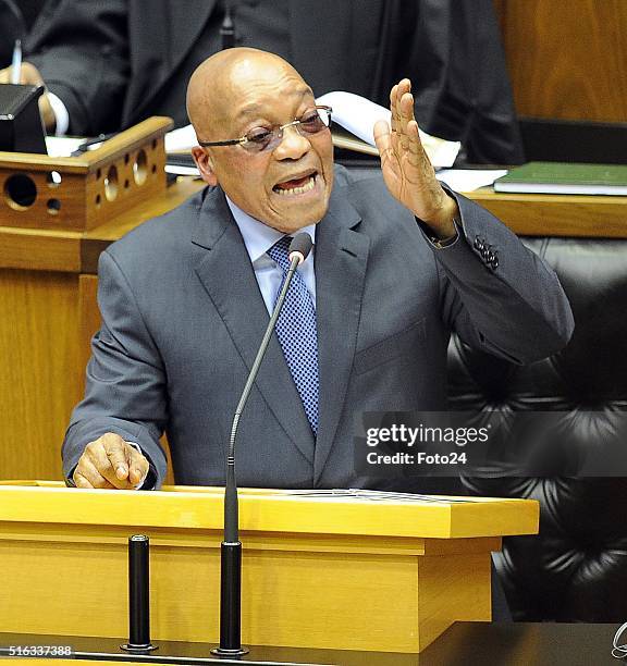 President Jacob Zuma responds to questions over his relationship with the Guptas in the National Assembly during a question and answer session on...