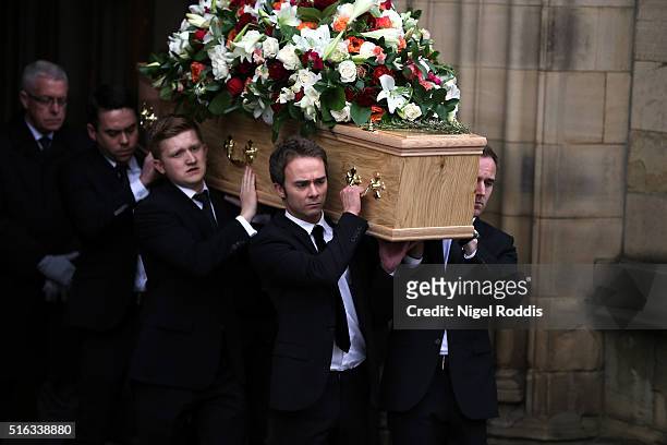 Coronation Street actors Jack Shepherd and Sam Aston carry the coffin after the funeral of Coronation Street scriptwriter Tony Warren at Manchester...