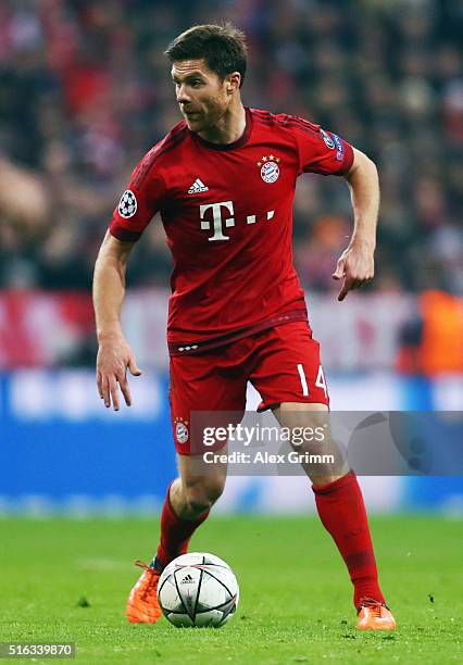 Xabi Alonso of Muenchen controles the ball during the UEFA Champions League Round of 16 Second Leg match between FC Bayern Muenchen and Juventus at...