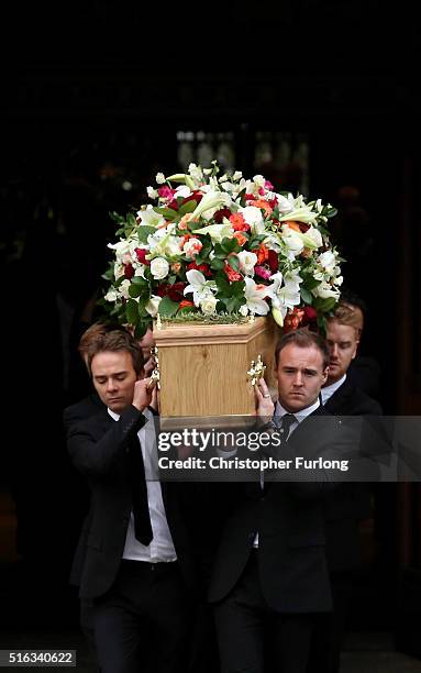 Coronation St cast members Jack P Shepherd and Alan Halsall carry the coffin of Coronation Street scriptwriter Tony Warren after his funeral service...