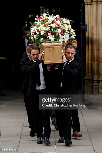 Coronation St cast members Jack P Shepherd and Alan Halsall carry the coffin of Coronation Street scriptwriter Tony Warren after his funeral service...
