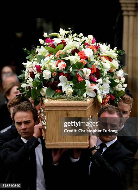 Coronation St cast members Jack P Shepherd and Alan Halsall carry the coffin of Coronation Street scriptwriter Tony Warren after his funeral service...