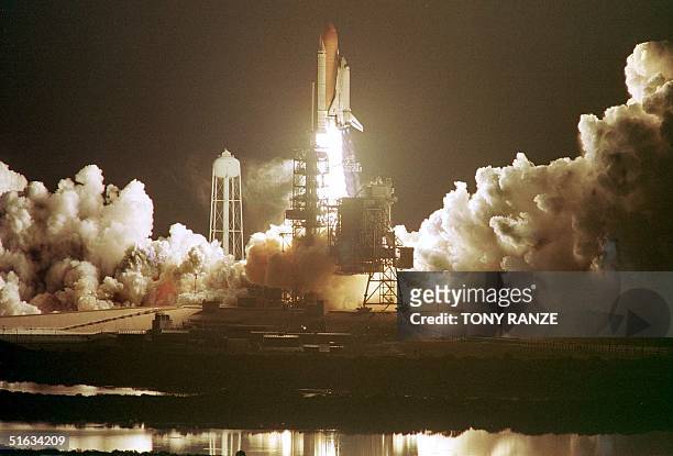 The Space Shuttle Endeavour blasts off launch pad 39A at the Kennedy Space Center, FL, early 04 December. Endeavour and a crew of six are on a...