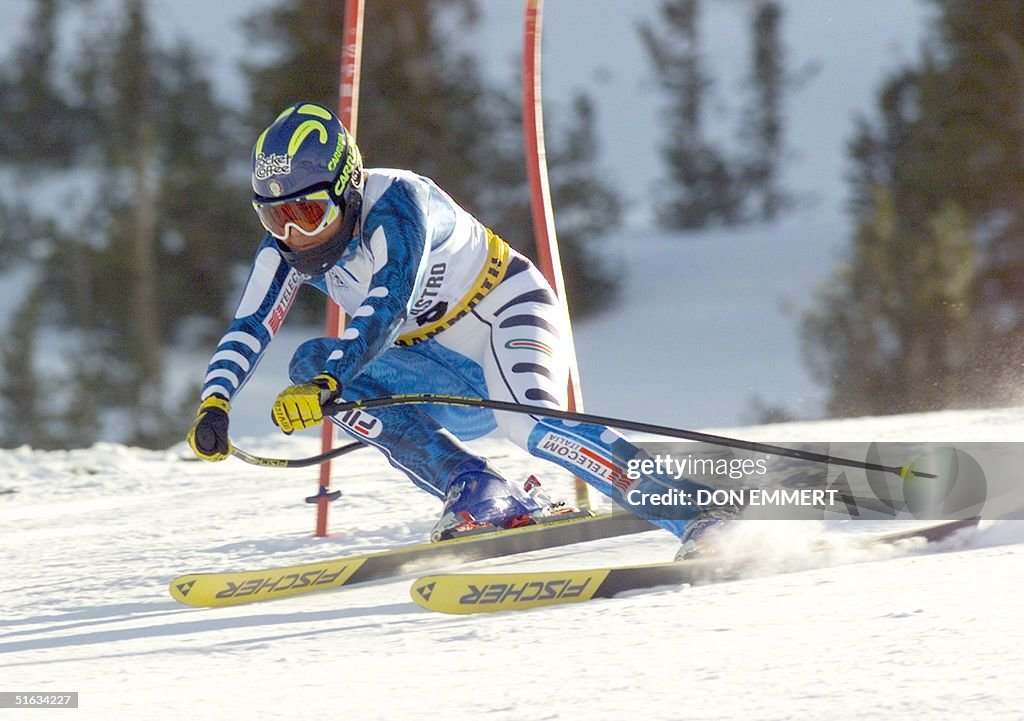 Italy's Isolde Kostner cuts around a gate 04 December during the ...