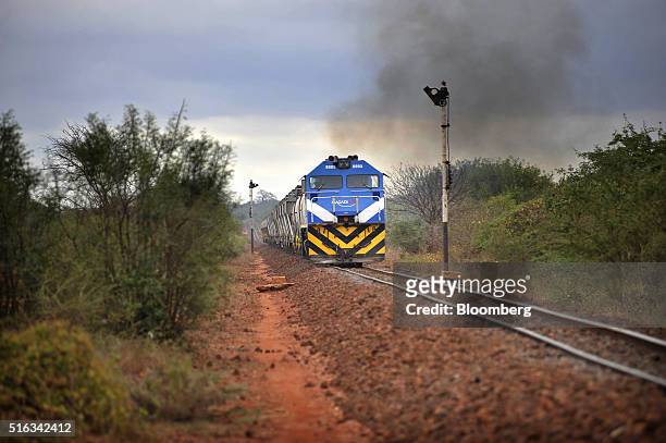 Diesel freight train from Mombasa pulls wagons along a section of old colonial era railway track near Mtito, Andei, Kenya, on Thursday, March 17,...