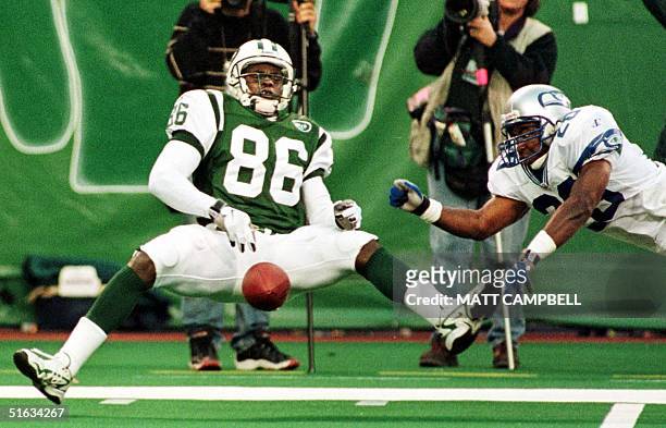 New York Jets wide receiver Alex Van Dyke can't hold onto the ball after colliding with the Seattle Seahawks defender Jay Bellamy in the fourth...
