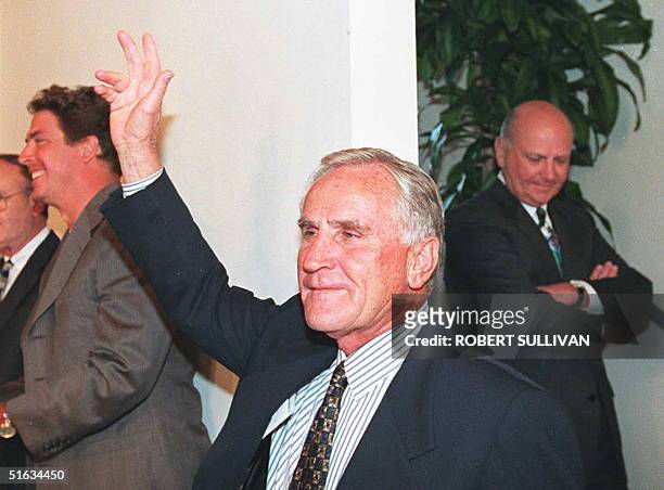 Miami Dolphins head coach Don Shula team owner Wayne Huizenga and quarterback Dan Marino arrive at a press conference to announce Shula's retirement...