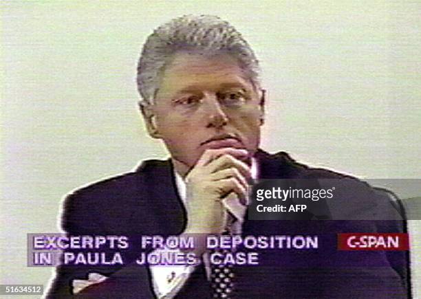 This 10 December image taken from C-Span television shows US President Bill Clinton giving videotaped sworn deposition in tha Paula Jones sexual...