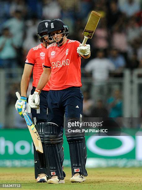 Mumbai, INDIA Joe Root of England raises his bat after scoring a half century during the ICC World Twenty20 India 2016 match between South Africa and...