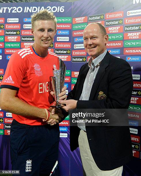 Mumbai, INDIA Joe Root of England receives the man of the match trophy after the ICC World Twenty20 India 2016 match between South Africa and England...