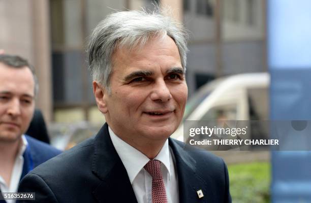 Austrian Prime Minister Werner Faymann arrives at the EU Council building to attend an European Union Summit in Brussels, on March 18, 2016. - EU...