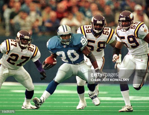 Detroit Lions running back Barry Sanders tries to outrun Minnesota Vikings defenders Corey Fuller , Ed McDaniel and Dixon Edwards during the fourth...