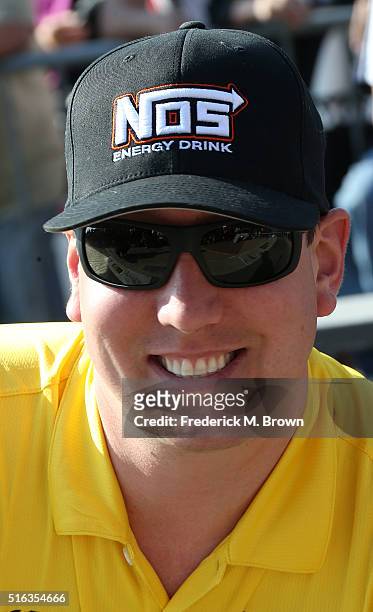 Race car driver Kyle Busch reacts during his Walk of Fame Induction Ceremony at the Auto Club 400 NASCAR Sprint Cup Series Event Weekend at the Auto...