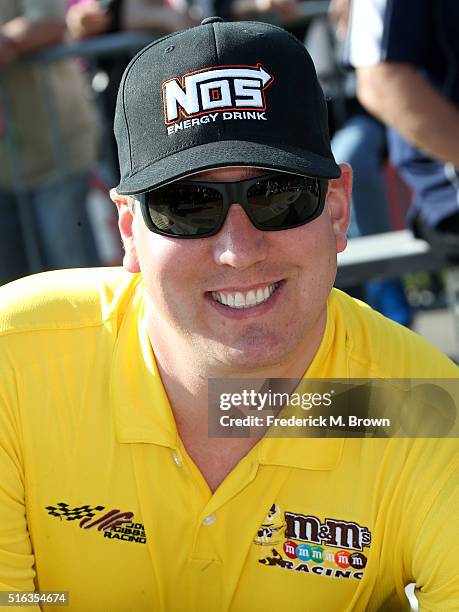 Race car driver Kyle Busch reacts during his Walk of Fame Induction Ceremony at the Auto Club 400 NASCAR Sprint Cup Series Event Weekend at the Auto...