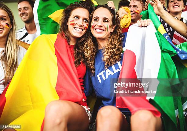 mixed national world supporter at the soccer stadium - italy v spain international friendly stock pictures, royalty-free photos & images