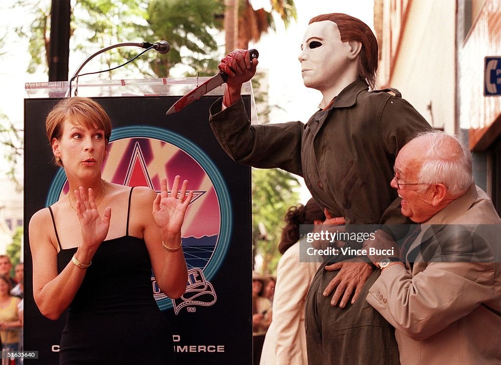 US actress Jamie Lee Curtis (L) confronts a prop o