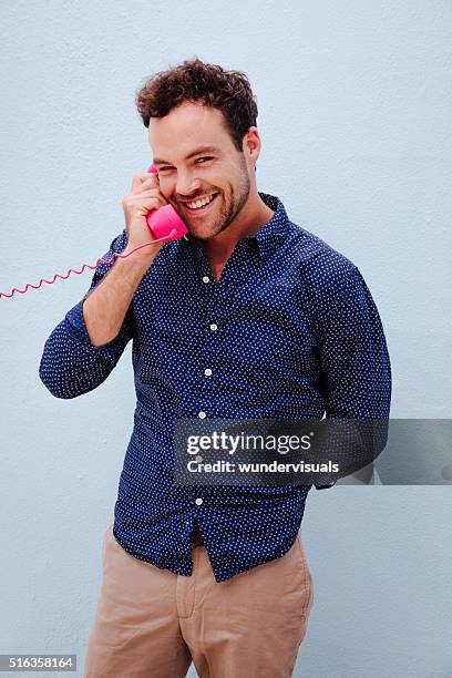 cute stylish guy talking on the pink telephone - the boy with pink hair stock pictures, royalty-free photos & images