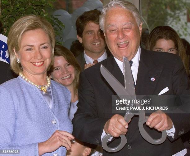 First Lady Hillary Clinton and Sargent Shirver , prepare to cut the ribbon during opening ceremonies of Shriver Hall 15 September in Washington, DC....