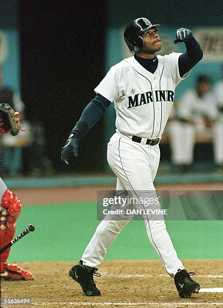 Seattle Mariner Ken Griffey Jr. Blasts his 56th home run during his team's 15-4 route of the Texas Rangers in Seattle, WA, 25 September. Griffey...