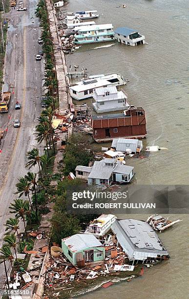 Destroyed houseboats lie along Houseboat Row 26 September after being hit by Hurricane Georges on Key West, FL. The eye of Georges is passed over Key...