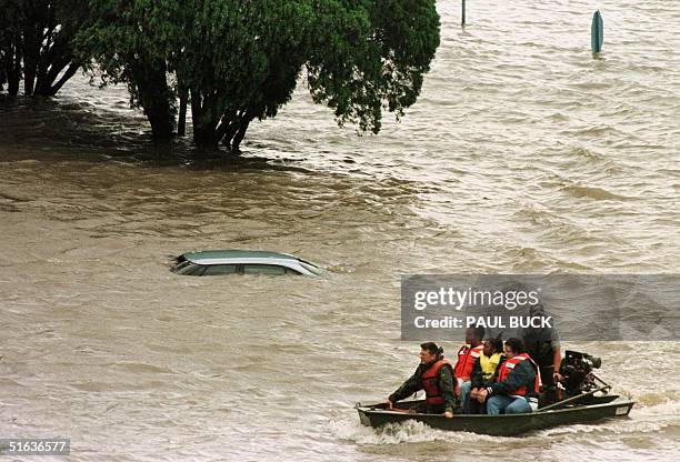 New Orleans Levee Board Police and their family members are rescued from offices at the Lakefront Airport 28 September in New Orleans, LA, from high...