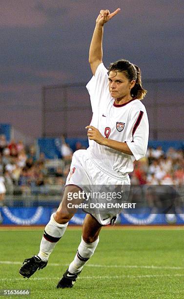 Mia Hamm of the US celebrates her goal in the first half of the US match against Denmark 25 July at the Goodwill Games in Uniondale, NY. AFP PHOTO...