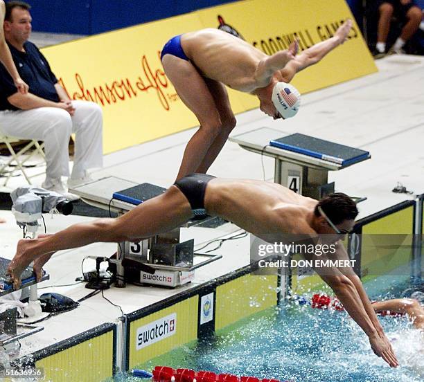 Russia's Alexander Popov jumps off the start ahead of Dan Phillips of the US during the men's 4x100 relay at the Goodwill Games in Uniondale, NY 02...